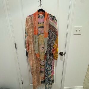 You can wear this with jeans or over a swimsuit or with a skirt and boots